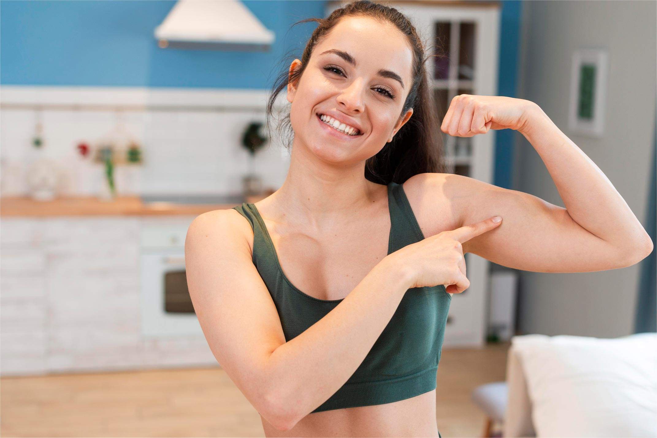portrait young woman showing her muscles